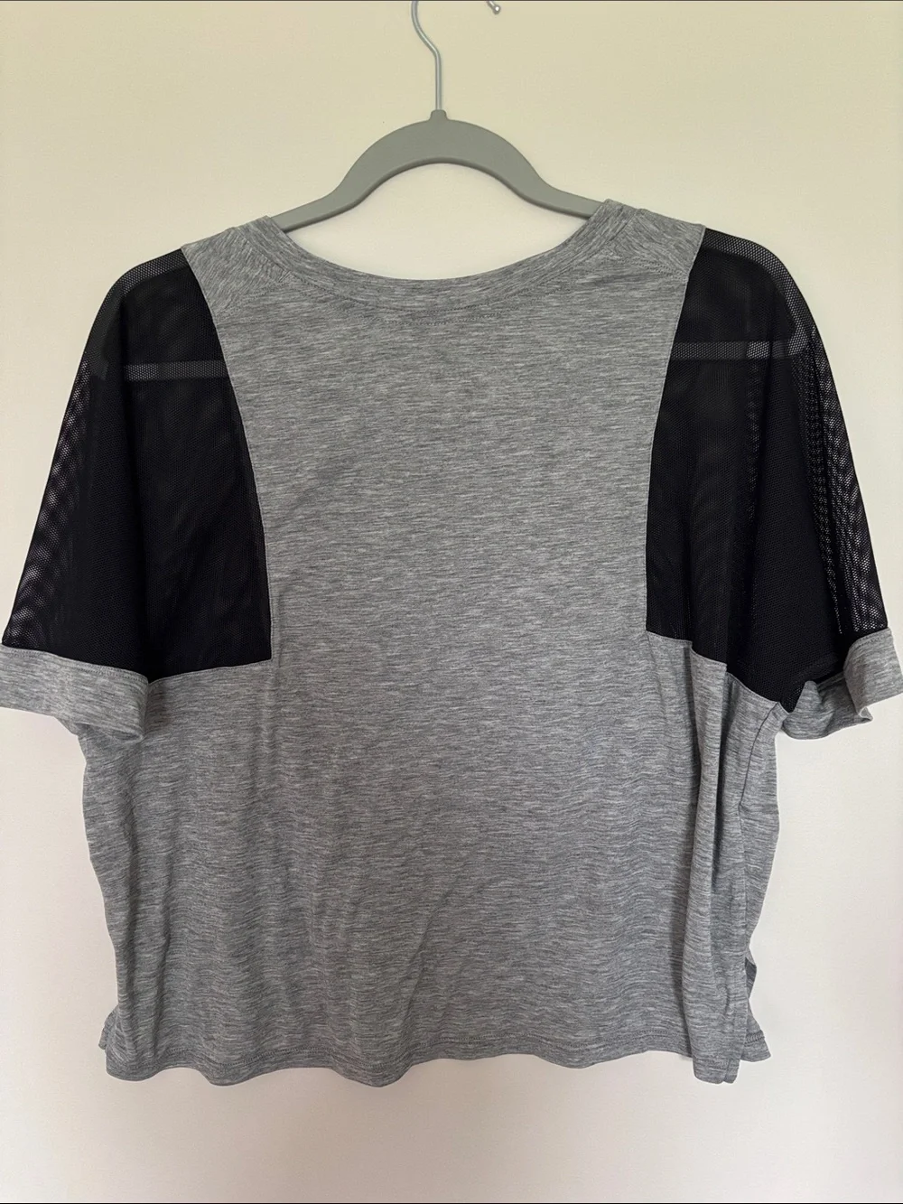 Woman’s Nike Gray Dri-FIT Heathered Performance Tee with Mesh Sleeves